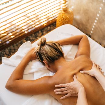 A Massage Therapist Massaging a Client's Back